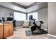 Well-lit office space featuring a desk, chair, exercise bike and large window at 1434 Braewood Ave, Highlands Ranch, CO 80129