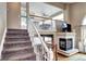 A view of the staircase and fireplace from the stairs at 1434 Braewood Ave, Highlands Ranch, CO 80129