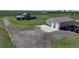 Panoramic view of the home, metal shop, and large parking pad with basketball hoop at 3308 County Road 19, Fort Lupton, CO 80621