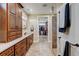 Bathroom features a tiled walk-in shower, vanity with storage, and neutral color palette at 3308 County Road 19, Fort Lupton, CO 80621
