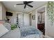 Cozy bedroom featuring a ceiling fan, closet and an ensuite bathroom for added convenience at 3308 County Road 19, Fort Lupton, CO 80621