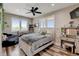 Cozy bedroom with a ceiling fan, two windows and rustic wood-look floors at 3308 County Road 19, Fort Lupton, CO 80621