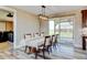 Bright dining area with a large window and sliding glass doors to let in natural light at 3308 County Road 19, Fort Lupton, CO 80621