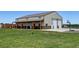 Spacious home with a large garage, covered porch, and ample room for parking and outdoor activities at 3308 County Road 19, Fort Lupton, CO 80621