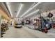 Spacious garage with high ceilings, vehicle on trailer and ample room for storage and hobbies at 3308 County Road 19, Fort Lupton, CO 80621