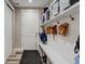 Practical mudroom with storage, coat hooks, and bench seating for organization as you enter at 3308 County Road 19, Fort Lupton, CO 80621