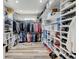 Organized walk-in closet with ample shelving and clothing racks at 3308 County Road 19, Fort Lupton, CO 80621