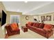 Basement featuring a large sofa, TV, and exercise bike at 7271 Brixham Cir, Castle Pines, CO 80108