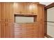 A closet featuring a light above a counter and many cabinets and drawers at 7271 Brixham Cir, Castle Pines, CO 80108