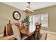 Traditional dining room features a wood table, chandelier, decorative mirror, and neutral colors for an elegant atmosphere at 7271 Brixham Cir, Castle Pines, CO 80108