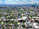Scenic aerial view showcases the home with a city skyline backdrop surrounded by green trees and buildings at 1258 N Downing St, Denver, CO 80218