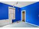 A blue bedroom shows a window, closet and cluttered floors at 1258 N Downing St, Denver, CO 80218