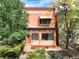 Charming brick home featuring a cozy front porch and well-maintained landscaping, located at 1258 at 1258 N Downing St, Denver, CO 80218