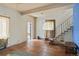 View of living room with wood floors, staircase, window, and view into another room at 1258 N Downing St, Denver, CO 80218