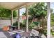 Covered patio area with stone flooring and outdoor access provides extra space and natural light at 1258 N Downing St, Denver, CO 80218