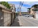 Street view shows garages and parked cars along the buildings in the neighborhood at 1258 N Downing St, Denver, CO 80218