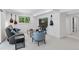 Comfortable basement living room featuring a sofa, accent chair, mounted TV, and guitars at 6075 S Filbert Ct, Centennial, CO 80121