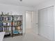 Neat bedroom with a bookshelf, closet, white walls, and neutral carpet at 6075 S Filbert Ct, Centennial, CO 80121