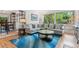 Bright living room with hardwood floors, plush seating, and natural light at 6075 S Filbert Ct, Centennial, CO 80121