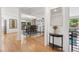 Open living space with hardwood floors, modern lighting, and seamless flow at 6075 S Filbert Ct, Centennial, CO 80121