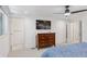Spacious primary bedroom with neutral walls and trim, wood dresser and bedroom set at 6075 S Filbert Ct, Centennial, CO 80121