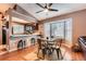 Bright dining area with a bay window, modern table and chairs, and adjacent kitchen access at 12060 N Holly Way, Brighton, CO 80602