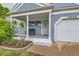 Inviting front porch with a white railing and a comfortable seating area, perfect for relaxing outdoors at 12060 N Holly Way, Brighton, CO 80602