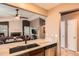 Bright, open kitchen with granite countertops and stainless steel dishwasher at 12060 N Holly Way, Brighton, CO 80602