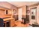 Home office with a desk, and a weight bench; great space for working out next to the bathroom at 12060 N Holly Way, Brighton, CO 80602
