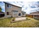 Backyard showing a concrete patio, lawn and fenced-in yard, ideal for outdoor enjoyment and privacy at 20305 E 41St Ave, Denver, CO 80249