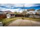 Backyard featuring a shed and patio, perfect for relaxing and entertaining at 20305 E 41St Ave, Denver, CO 80249