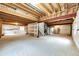 Spacious unfinished basement with stairs, offering potential for customization at 20305 E 41St Ave, Denver, CO 80249
