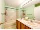 Bathroom featuring double sinks, a shower and tub, and ample countertop space at 20305 E 41St Ave, Denver, CO 80249