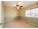 This bedroom features carpeted flooring and a ceiling fan for added comfort at 20305 E 41St Ave, Denver, CO 80249