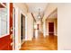 Welcoming foyer with hardwood flooring, arched doorways, and a view into other living spaces at 20305 E 41St Ave, Denver, CO 80249
