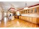 Spacious kitchen featuring hardwood floors, ample counter space, and stainless steel appliances for modern living at 20305 E 41St Ave, Denver, CO 80249