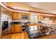 Modern kitchen featuring granite countertops, stainless steel appliances, and a convenient center island at 20305 E 41St Ave, Denver, CO 80249