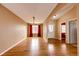 Living room with hardwood floors, neutral walls, and a large window at 20305 E 41St Ave, Denver, CO 80249