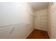 Well-organized walk-in closet with custom shelving and hardwood floors, maximizing storage space at 20305 E 41St Ave, Denver, CO 80249