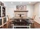 Farmhouse-style dining room with brick fireplace and rustic wooden table at 360 S 30Th Ave, Brighton, CO 80601