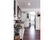 Bright entryway with dark hardwood floors, view into kitchen at 360 S 30Th Ave, Brighton, CO 80601