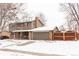 Two-story house with brick and siding exterior, attached garage, and wooden fence at 360 S 30Th Ave, Brighton, CO 80601