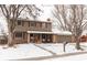 Two-story house with brick and siding exterior, covered porch, and attached garage at 360 S 30Th Ave, Brighton, CO 80601