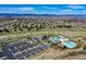 Overhead view of community pool and amenities with distant mountain views and neighborhood in the background at 1786 Quartz St, Castle Rock, CO 80109