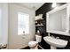 Stylish bathroom with dark accent wall and modern vanity at 1786 Quartz St, Castle Rock, CO 80109