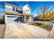 Two-story home with attached garage and landscaped front yard at 1786 Quartz St, Castle Rock, CO 80109