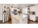 Modern kitchen with granite counters, stainless steel appliances and center island at 1786 Quartz St, Castle Rock, CO 80109