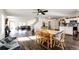 Open concept kitchen and dining area with hardwood floors and modern appliances at 1786 Quartz St, Castle Rock, CO 80109