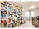 Well-organized laundry room with ample storage shelving at 1786 Quartz St, Castle Rock, CO 80109