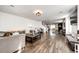 Open-concept living room with hardwood floors and plenty of seating at 1786 Quartz St, Castle Rock, CO 80109